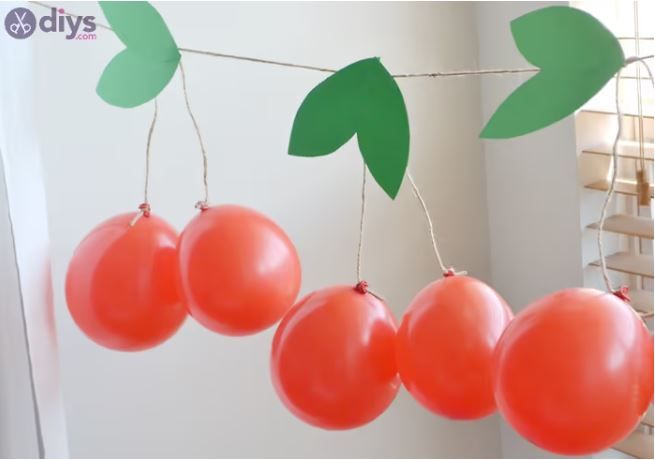 Here is a fun way to tie your balloons into cherries