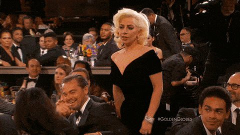 Leonardo DiCaprio makes a face at Lady Gaga